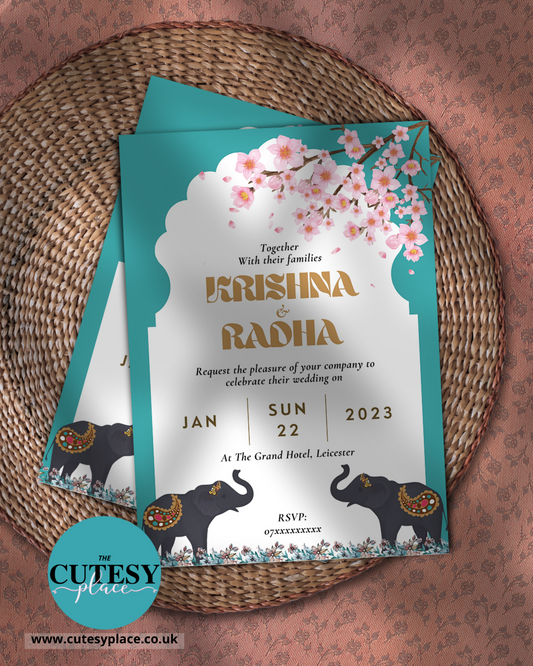 Wedding invitation card with elephants and cherry blossoms on a woven mat